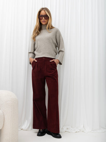 Burgundy pleated corduroy trousers